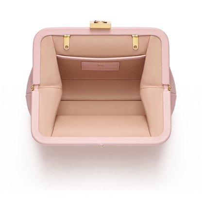 Leather bag with signature clasp and removable strap
