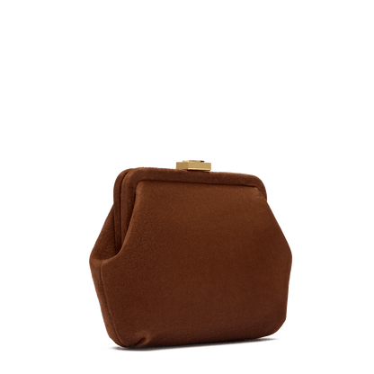 Suede bag with signature clasp and removable strap