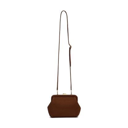 Suede bag with signature clasp and removable strap