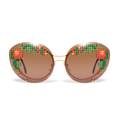 Sunglasses with hand-embroidered lenses