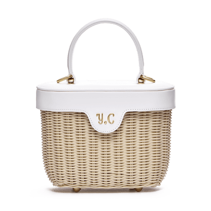 Woven basket with leather cover and floral lining