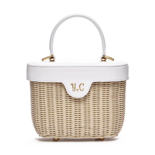 Woven basket with leather cover and floral lining
