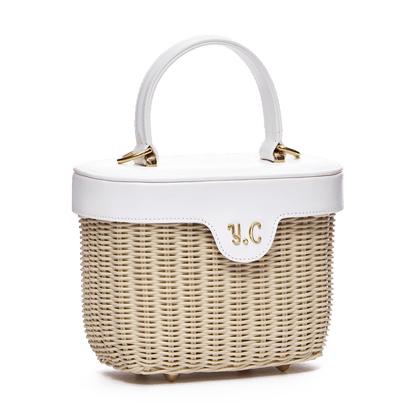 Woven basket with leather cover and floral lining