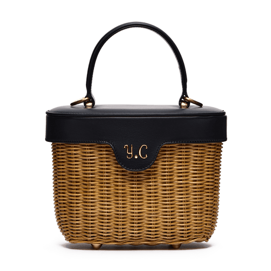 Woven basket with leather cover and floral lining