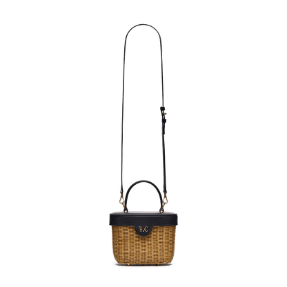 Woven basket with leather cover and floral lining