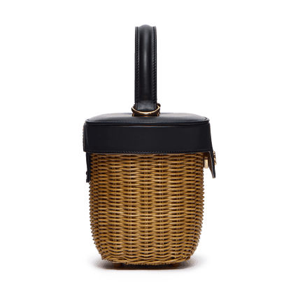 Woven basket with leather cover and floral lining