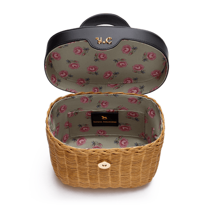 Woven basket with leather cover and floral lining