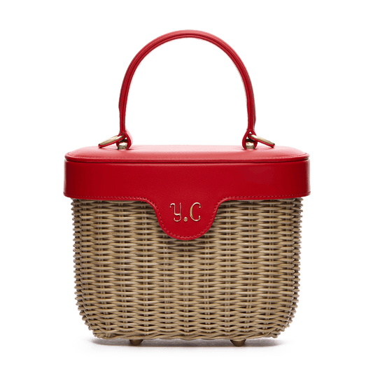 Woven basket with leather cover and floral lining