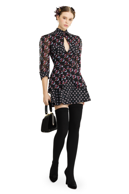 Silk peplum blouse with a signature print