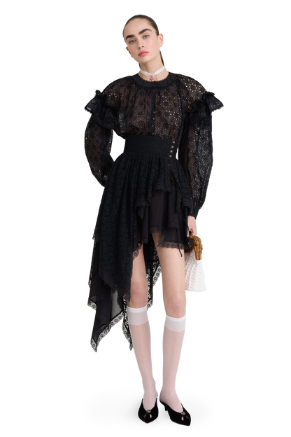 Embroidered cotton blouse with ruffled shoulders and an open back