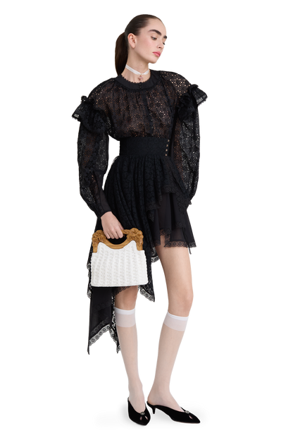 Embroidered cotton blouse with ruffled shoulders and an open back
