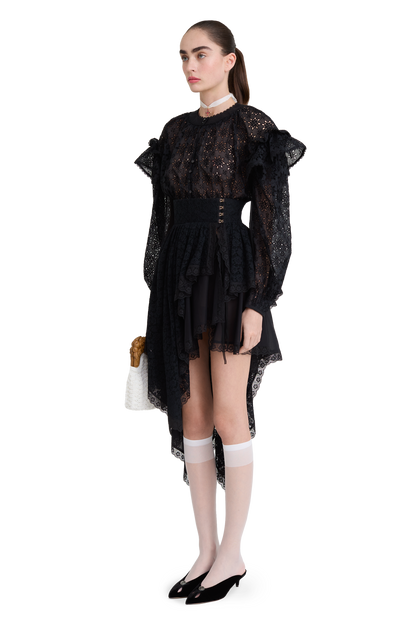 Embroidered cotton blouse with ruffled shoulders and an open back