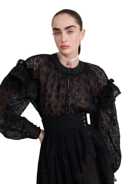 Embroidered cotton blouse with ruffled shoulders and an open back