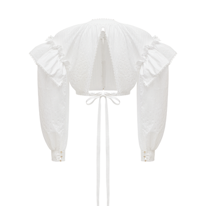 Cotton blouse with ruffled shoulders and an open back